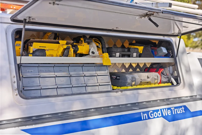 Tools and organized storage inside an H2O Plumbing Authority service truck