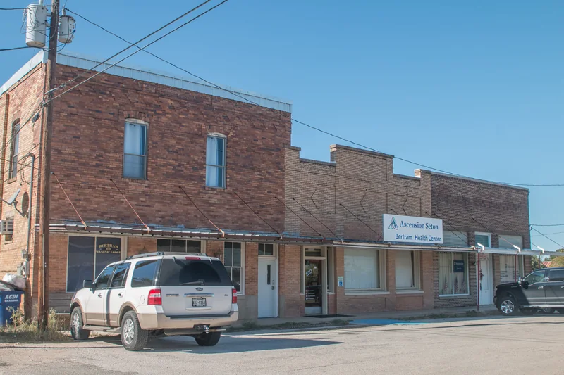 Historic brick storefronts in downtown Bertram, Texas.