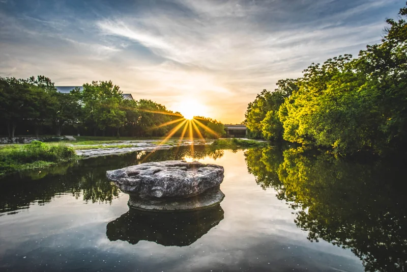Round Rock at sunset A round rock formation in a creek at sunset in Round Rock, Texas.